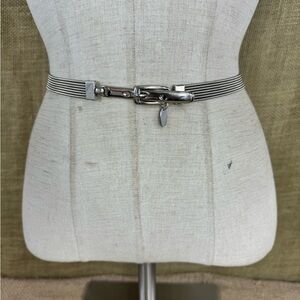 Vintage 1980’s women’s designer Motion East metal stretch belt . S-M 30-34 inch